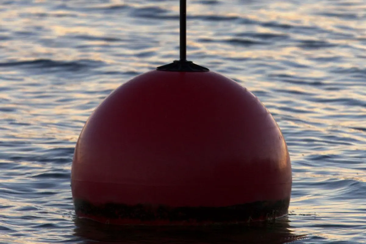 Red can shaped buoy mark